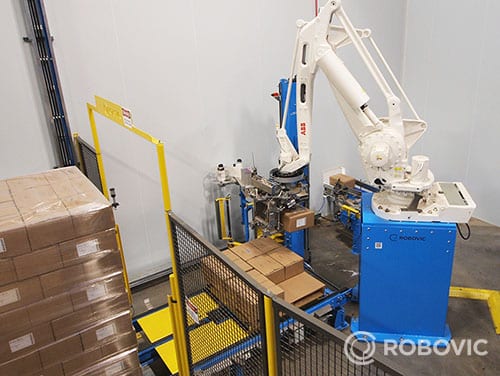Palettiseur de caisses - Robovic Inc palettiseur de caisses lors de la dépose angulaire